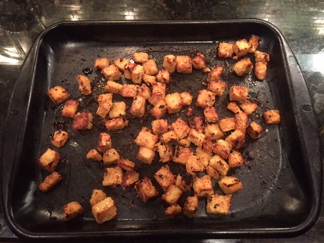 Cubes of Organic Tempeh cooked on a pan