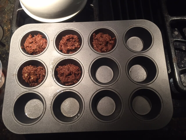 Chocolate Protein Muffin Batter in Muffin Tin on Stove top